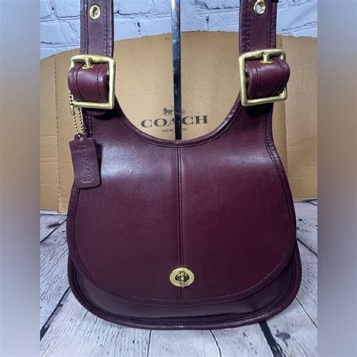 Rediscovering Elegance: The Vintage Coach Burgundy Crescent
